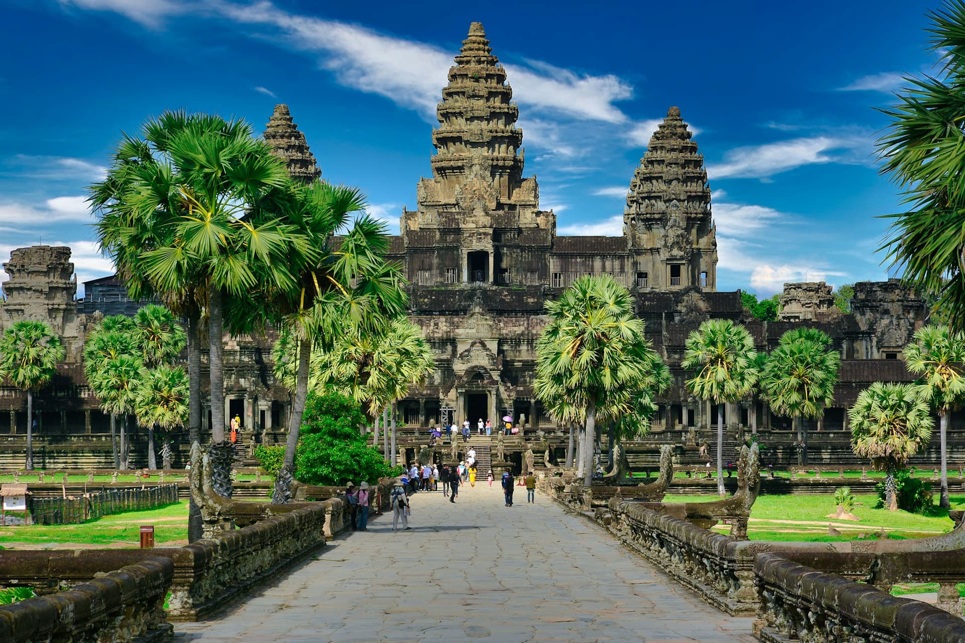 Angkor Wat temple at sunrise with reflecting pool