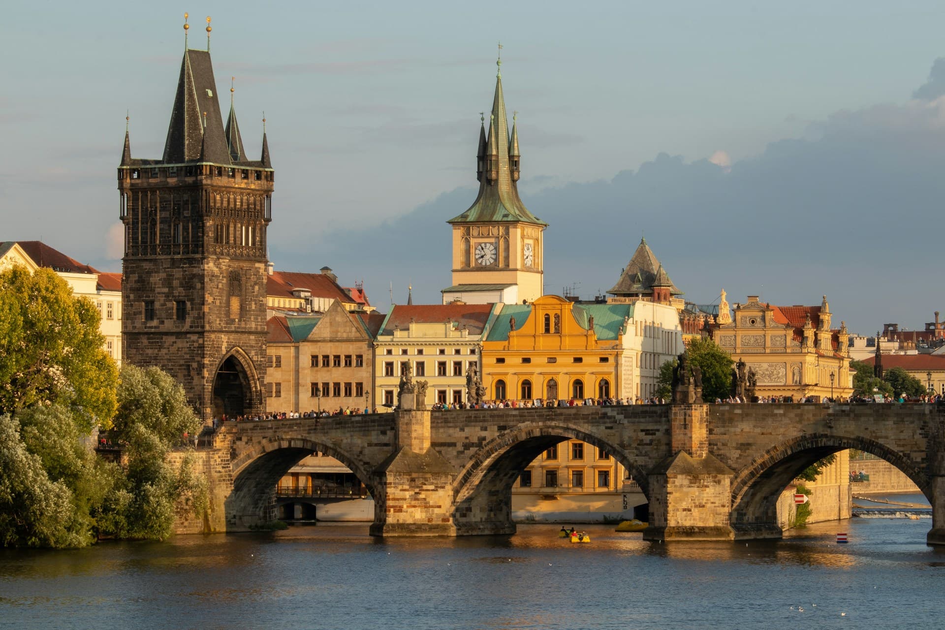 Charles Bridge and Prague Castle at golden hour over the Vltava River
