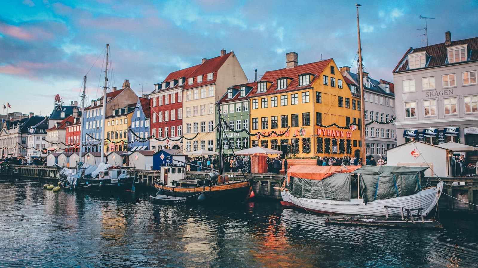 Colorful townhouses and moored boats along Copenhagen's Nyhavn canal