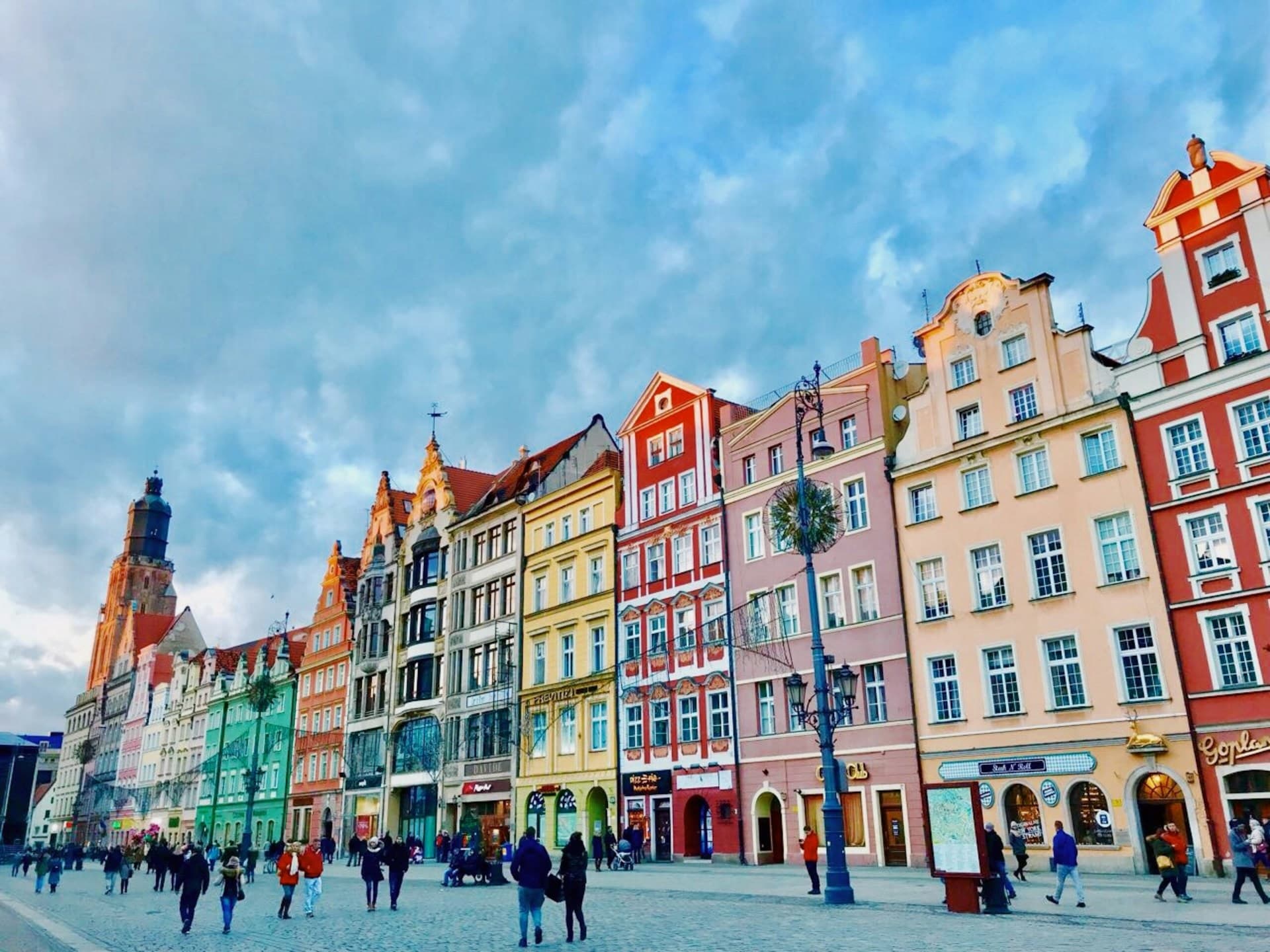 Kraków's Main Market Square (Rynek Główny) with St. Mary's Basilica at dusk