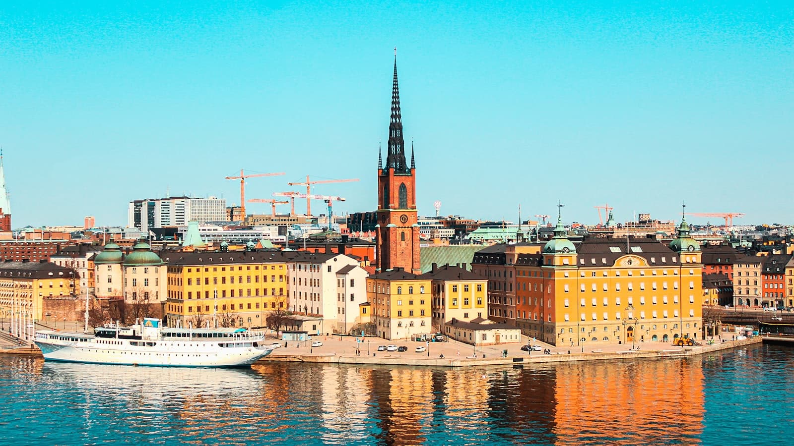 Riddarholmen church spire and Stockholm's waterfront in summer sunshine