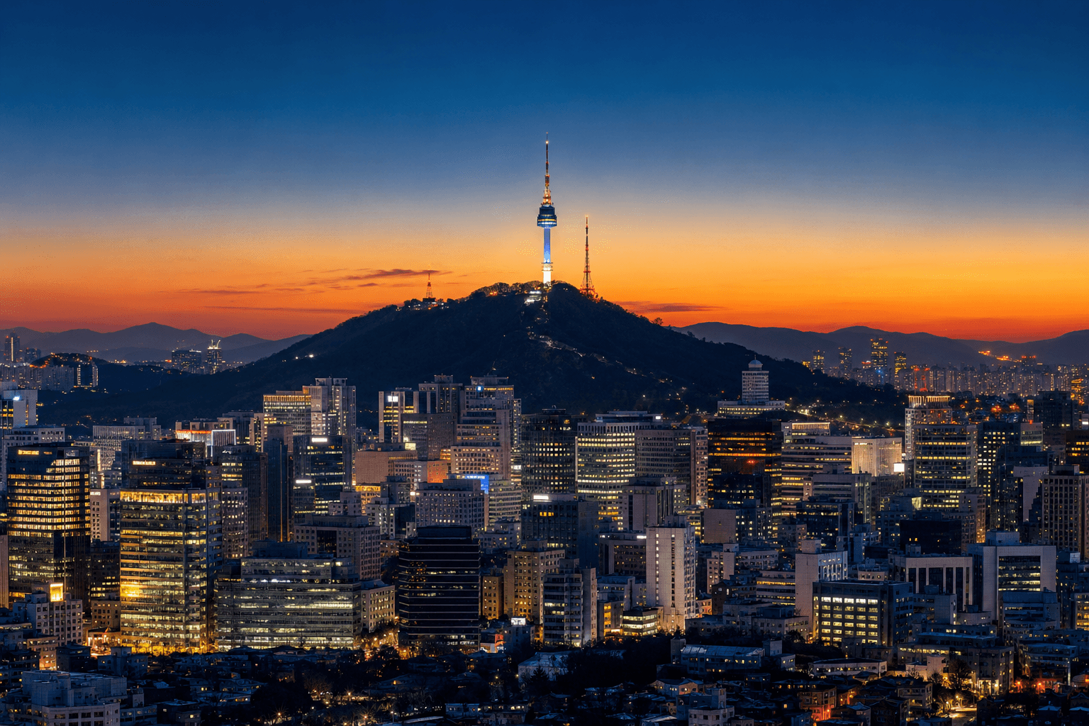 Seoul skyline at dusk with Namsan Tower and neon city lights
