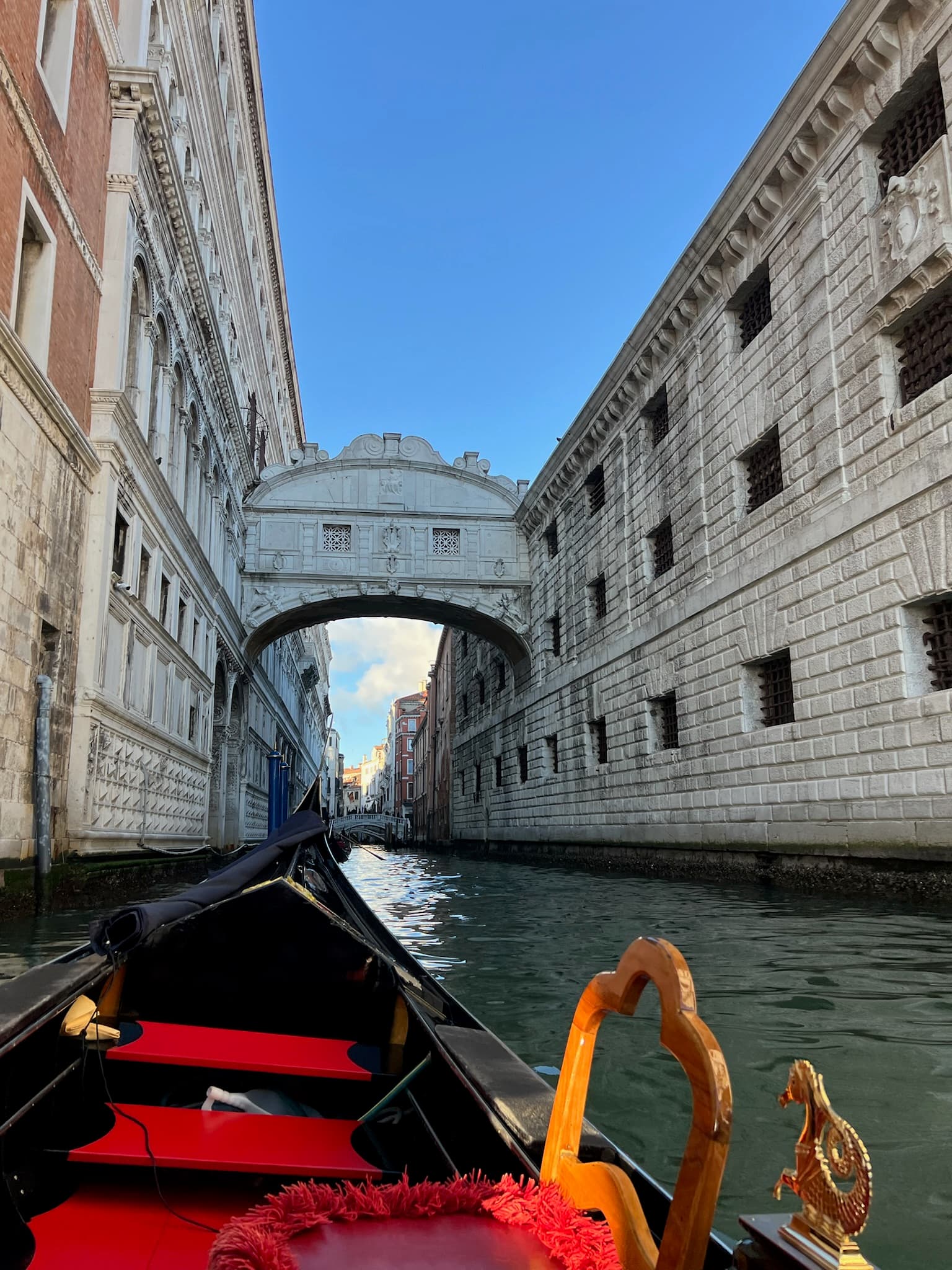 View of the Bridge of Sighs from inside a gondola on the canal below, Venice