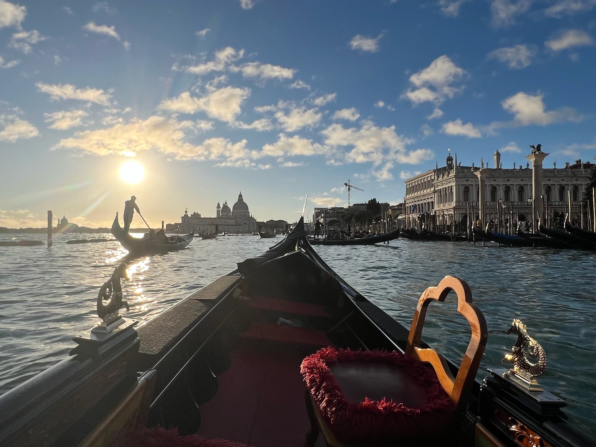 Gondola on the Grand Canal at sunset with Santa Maria della Salute in the background, Venice