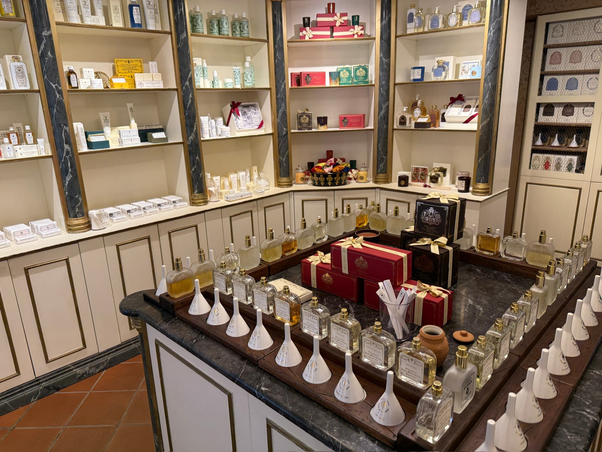 Interior of Santa Maria Novella in Venice, showing rows of fragrances and apothecary products